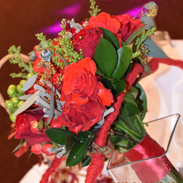 bridal bouquet of roses, hypericum berry, brunia, rascus and eucalyptus