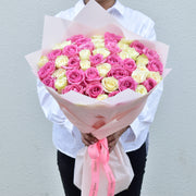 51 pink and white mixed roses bouquet with pink wrap - valentine special