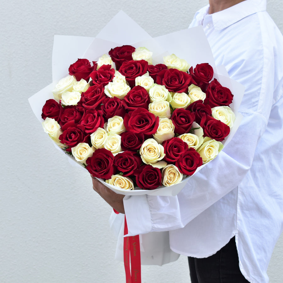red and white premium roses bouquet with white wrap