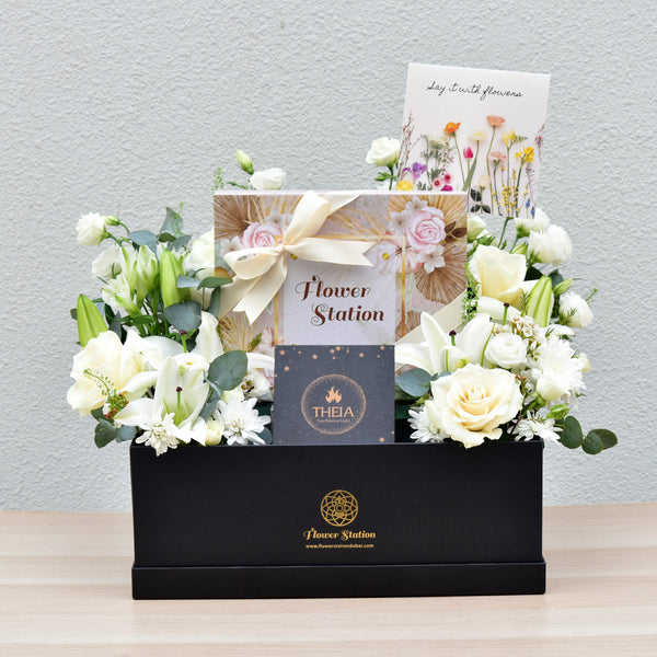 gift hamper of flowers, chocolates, scented candles