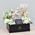 gift hamper of flowers, chocolates, scented candles