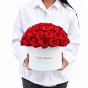 forever red roses in a hatbox

