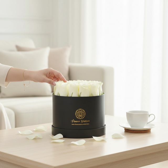 luxury white roses in black hat box
