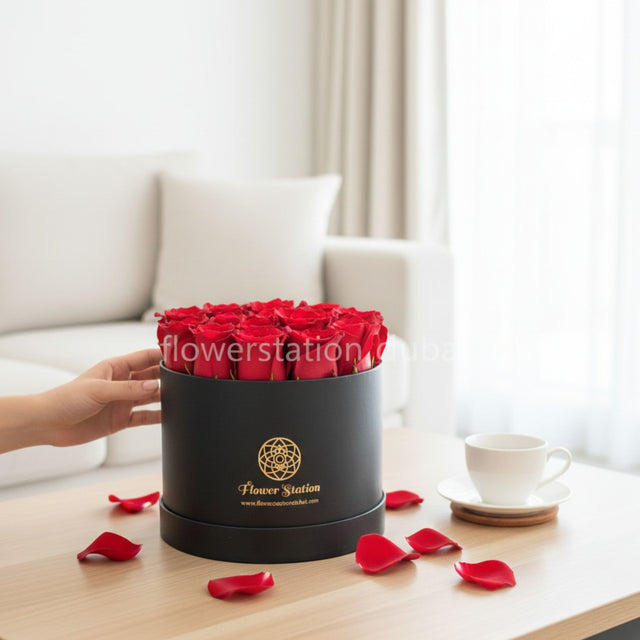 20 premium red roses in a black round hatbox
