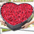 red roses in heart box