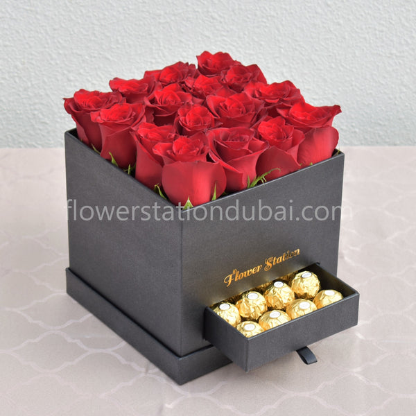 red roses with ferrero rocher in box