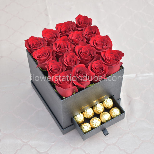 red roses with ferrero rocher in box